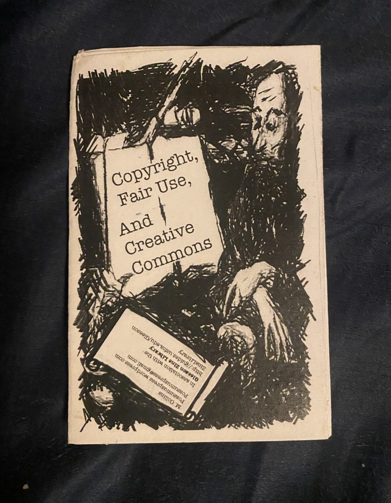 Cover of zine: Dark drawn image of a man with long beard and long fingersin front of an easel on which the title is written